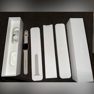 2016 rose gold Apple Series 1 Smartwatch with Silver and White Band